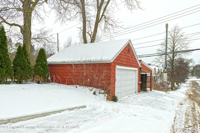 view of snow covered garage