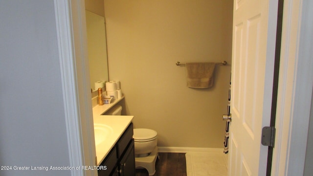 bathroom with vanity and toilet