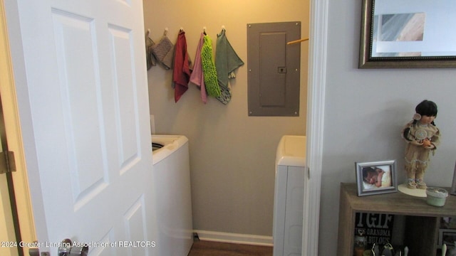 bathroom featuring electric panel and washer and dryer