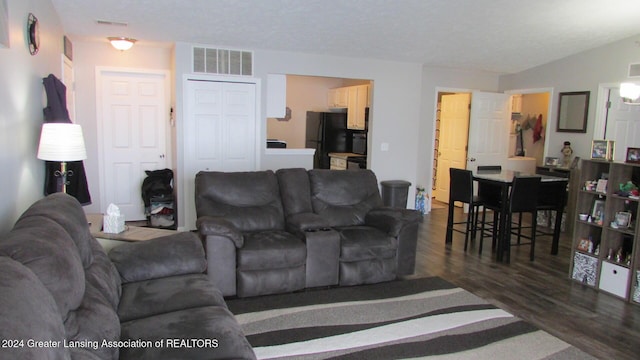 living room featuring dark hardwood / wood-style floors