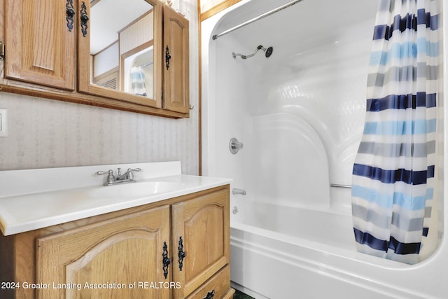 bathroom featuring vanity and shower / tub combo with curtain