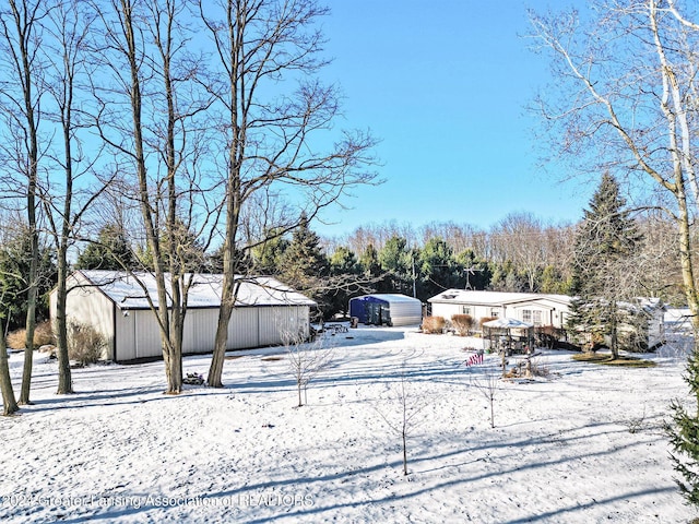 view of yard layered in snow