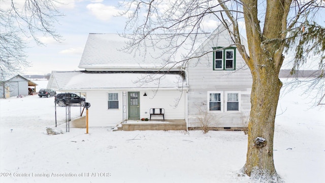 view of snow covered house