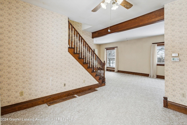 interior space with ceiling fan and light carpet