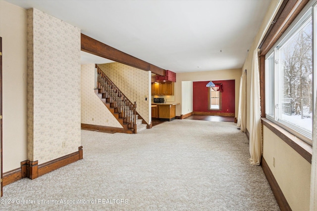 unfurnished living room with light carpet