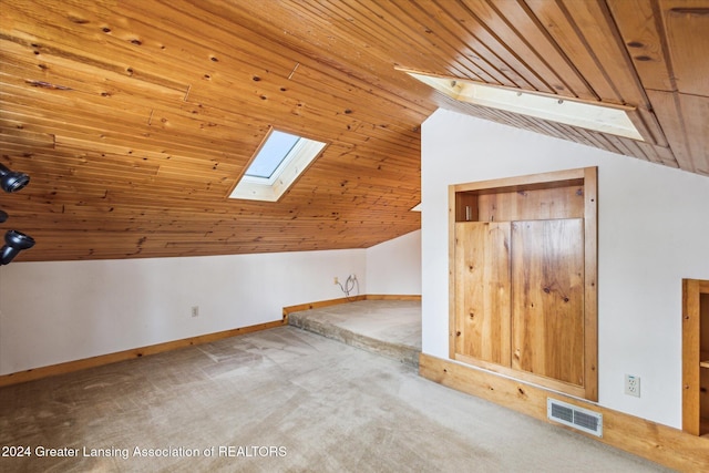 bonus room featuring carpet, lofted ceiling with skylight, and wooden ceiling