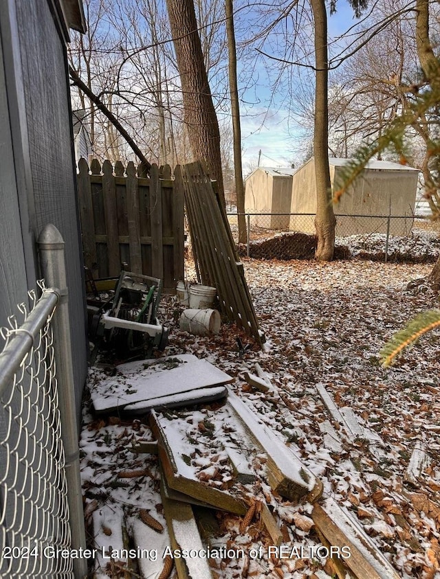 view of yard layered in snow