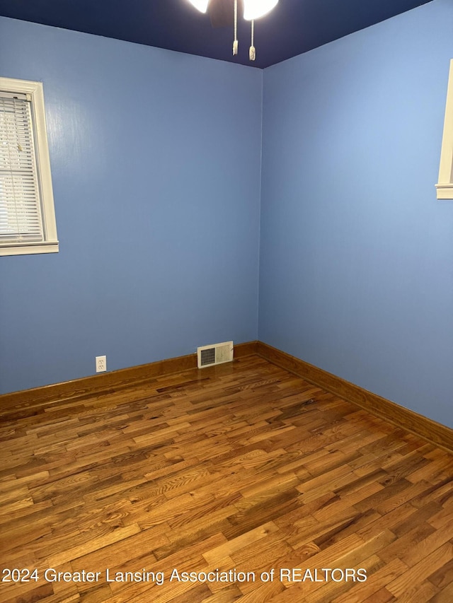 empty room featuring hardwood / wood-style floors