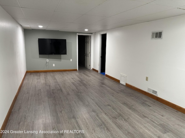 basement with hardwood / wood-style floors