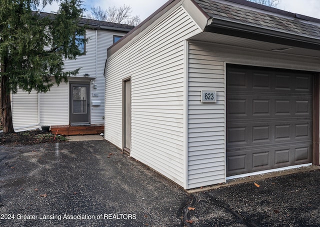 view of side of property featuring a garage