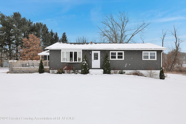 single story home featuring a deck