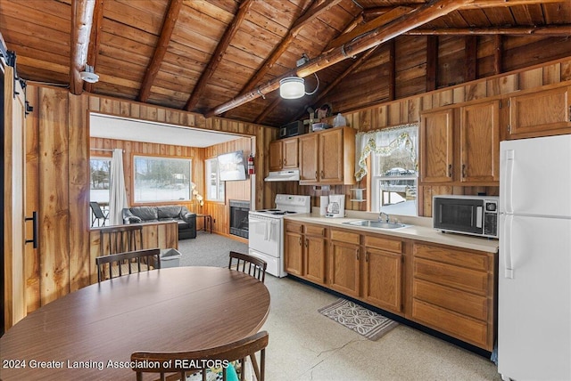 kitchen featuring white appliances, wood ceiling, wooden walls, and beamed ceiling