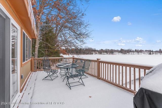 view of snow covered deck