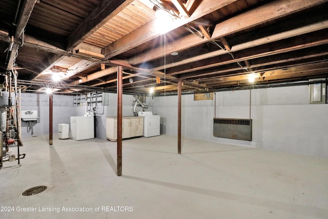 basement with washer and clothes dryer