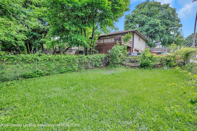 view of yard featuring a wooden deck