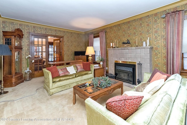 living room with crown molding, carpet, and a fireplace