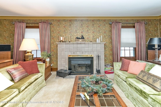 living room with light colored carpet and a tile fireplace