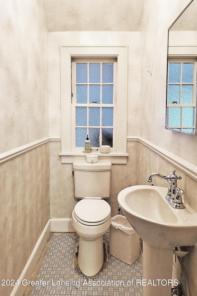 bathroom with tile patterned floors and toilet