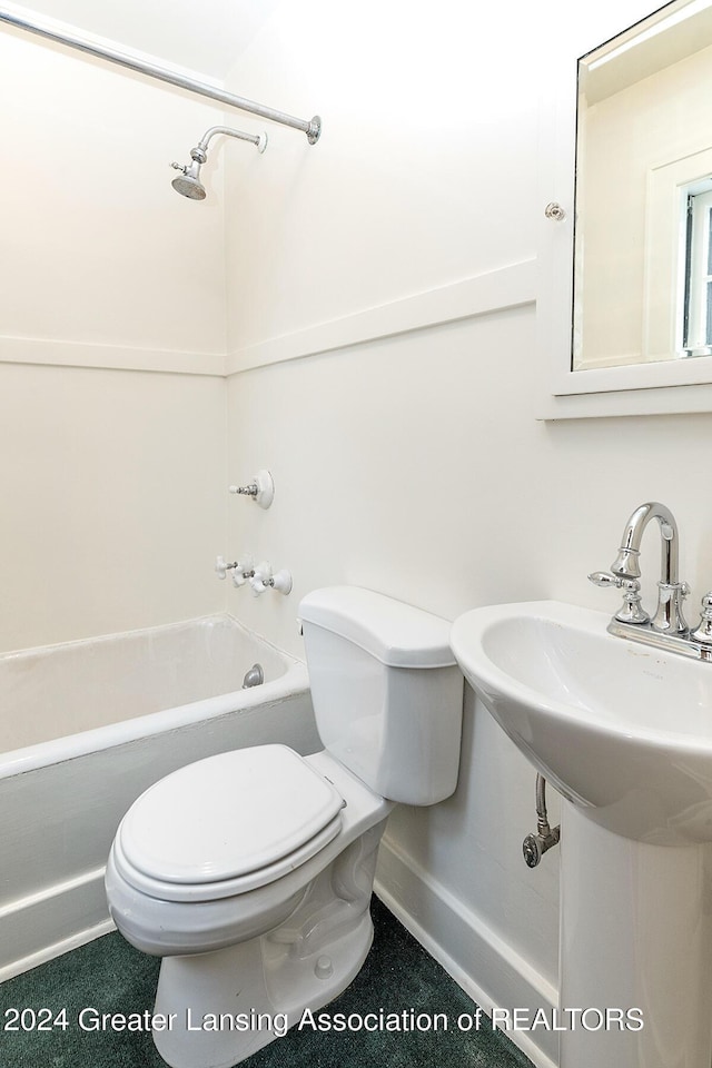 full bathroom with toilet, sink, and tub / shower combination