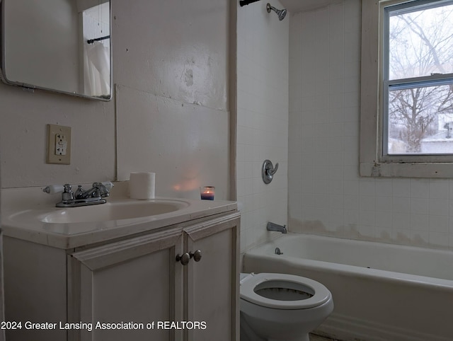 full bathroom with toilet, bathing tub / shower combination, and vanity