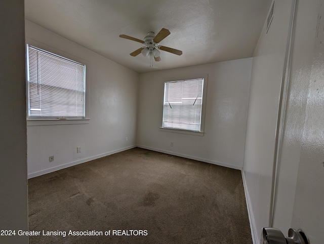 spare room with ceiling fan and carpet floors