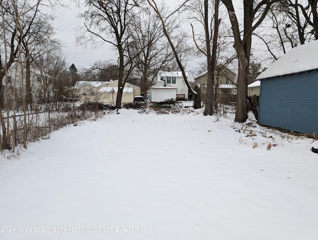 view of yard covered in snow