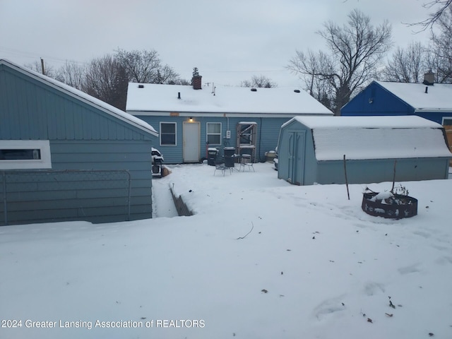 view of snow covered house