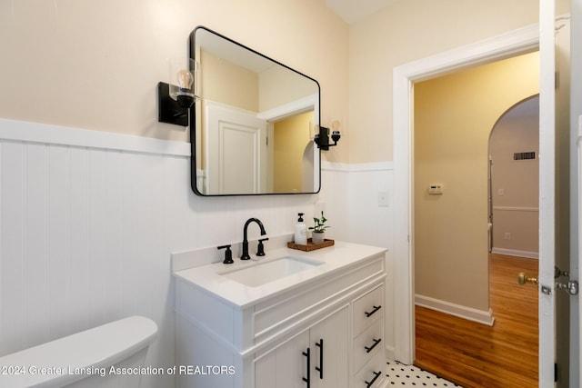 bathroom featuring toilet and vanity