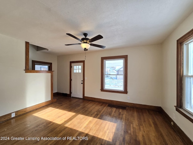 entrance foyer featuring ceiling fan, hardwood / wood-style floors, and a textured ceiling