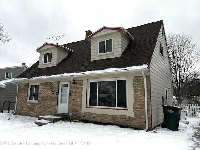 view of new england style home