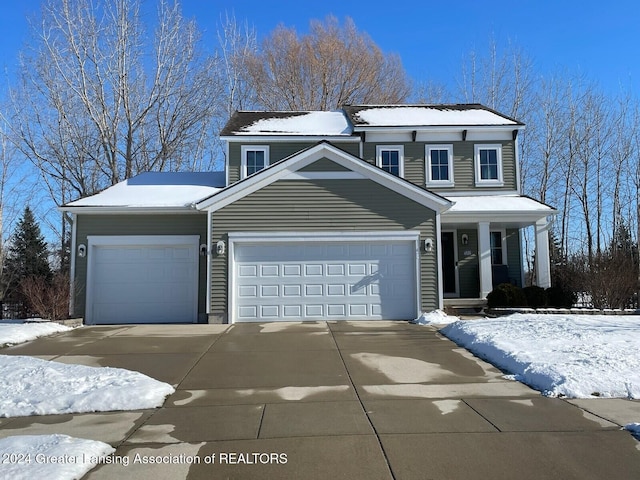 front of property with a garage