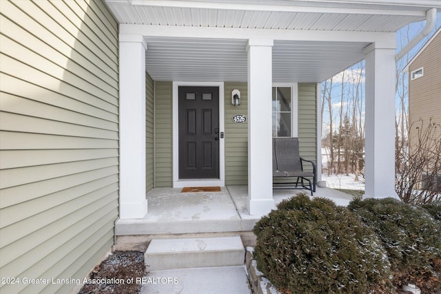 entrance to property with a porch