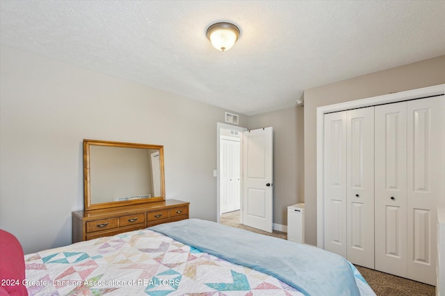 bedroom featuring a closet and carpet flooring