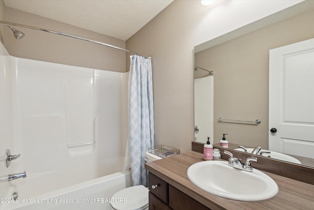 full bathroom featuring toilet, vanity, shower / bath combination with curtain, and a textured ceiling