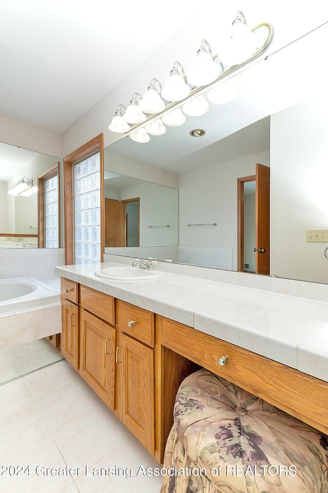 bathroom featuring tile patterned flooring and vanity