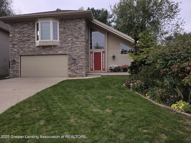 view of property featuring a garage and a front yard