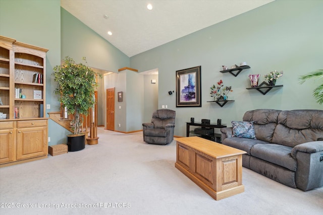 living room featuring high vaulted ceiling and light colored carpet