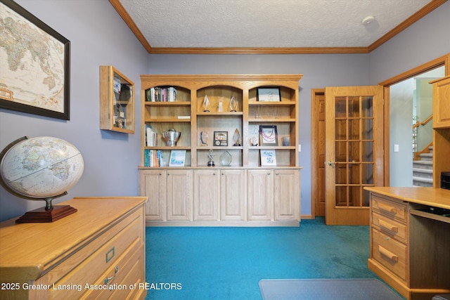 office area with ornamental molding, a textured ceiling, and dark colored carpet