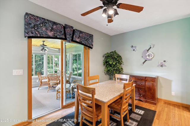 dining room featuring light hardwood / wood-style flooring and ceiling fan