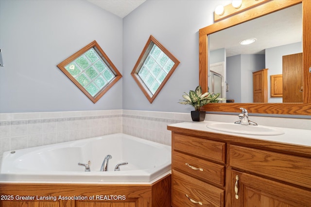 bathroom featuring independent shower and bath and vanity