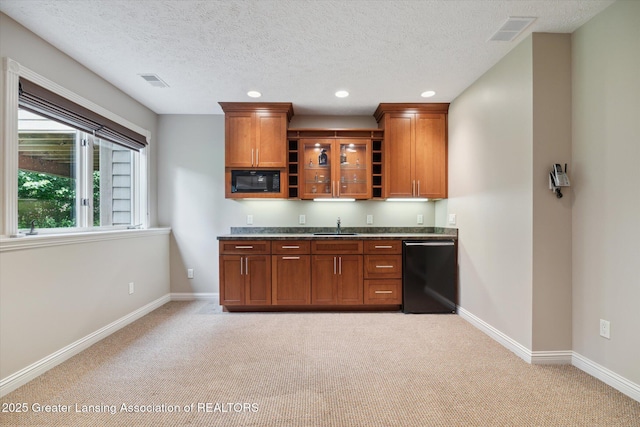 bar featuring sink, light colored carpet, a textured ceiling, and black appliances