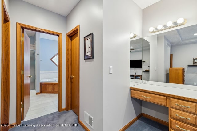 bathroom with vanity and a bathtub