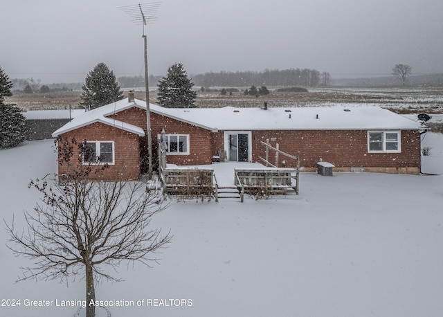 view of snow covered house