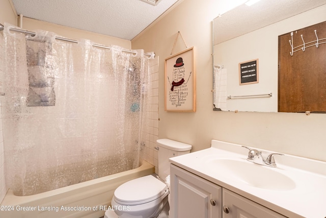 full bathroom with vanity, shower / bath combo, a textured ceiling, and toilet