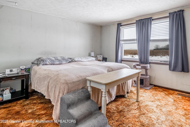 bedroom featuring a textured ceiling