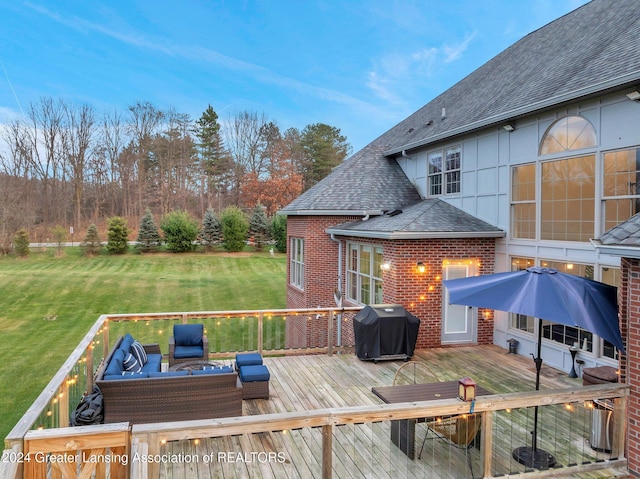 wooden deck with outdoor lounge area, area for grilling, and a lawn