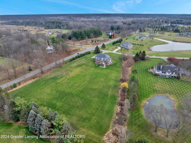 drone / aerial view featuring a water view and a rural view