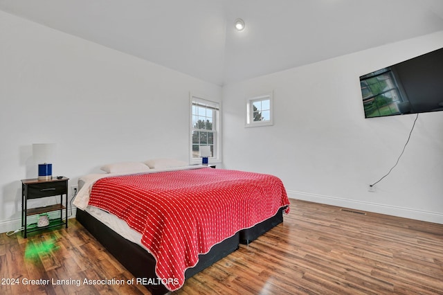 bedroom with hardwood / wood-style floors