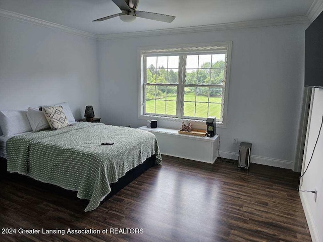 bedroom with ornamental molding, dark hardwood / wood-style floors, and ceiling fan