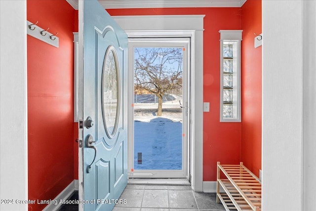 doorway to outside with light tile patterned floors